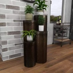 Brown Metal Pillar Style Pedestal Table with Hammered Design (Set of 4) by Litton Lane -Outlet Litton Lane Store brown litton lane coffee tables 22024 1f 1000