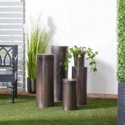 Brown Metal Pillar Style Pedestal Table with Hammered Design (Set of 4) by Litton Lane -Outlet Litton Lane Store brown litton lane coffee tables 22024 31 1000