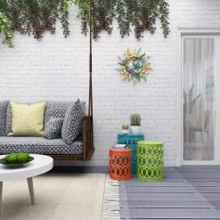 16 in. Multi Colored Round Iron Indoor Outdoor Stackable Nesting End Table with Laser Carved Trellis Design 3-Pieces by Litton Lane -Outlet Litton Lane Store multi litton lane coffee tables 29028 76 1000